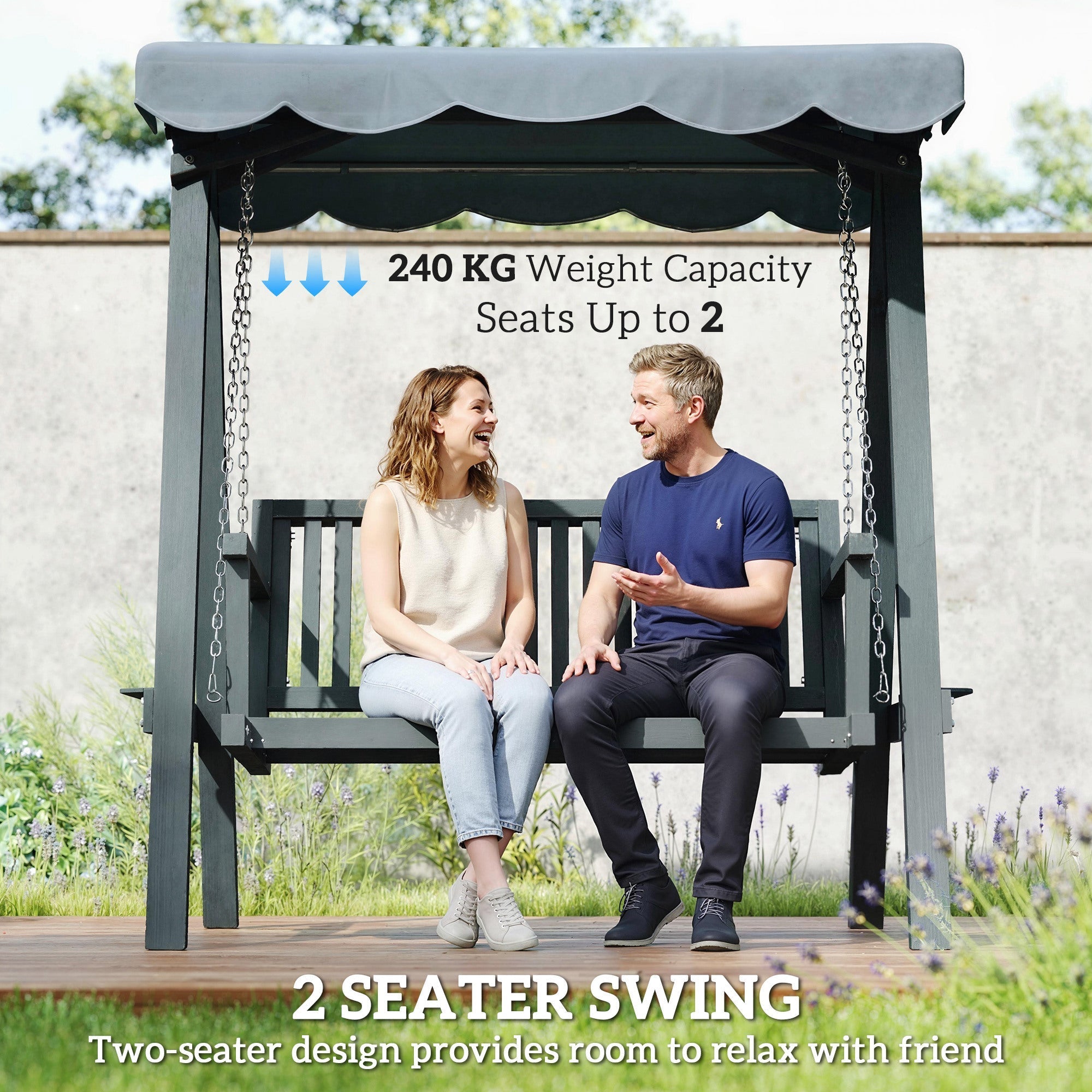 Dark gray metal-framed two-seater swing chair outdoor with scalloped canopy and chain suspensions for garden swings