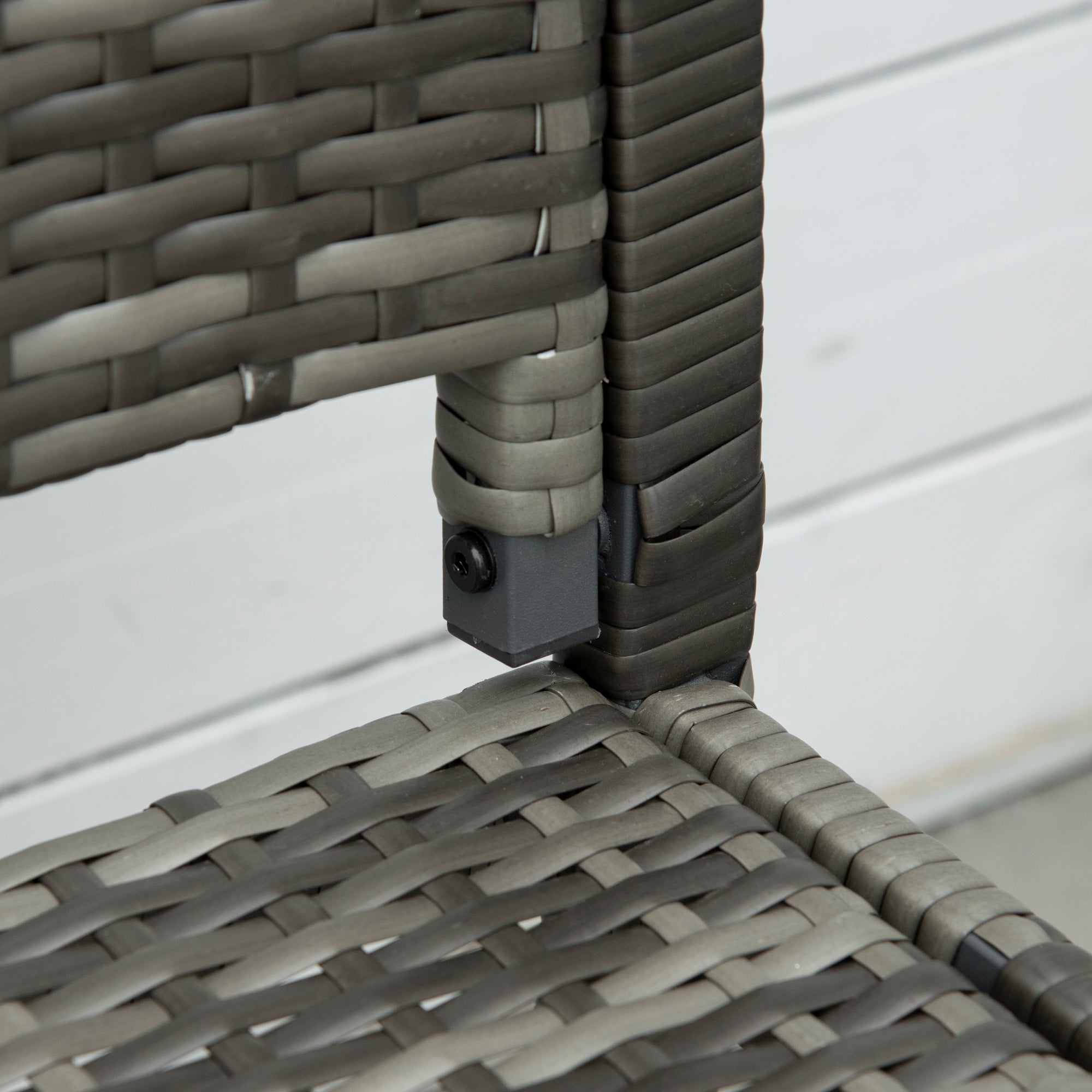 Gray woven wicker frame and dark gray plastic connector of outsunny 2 seater garden bench with assembly required