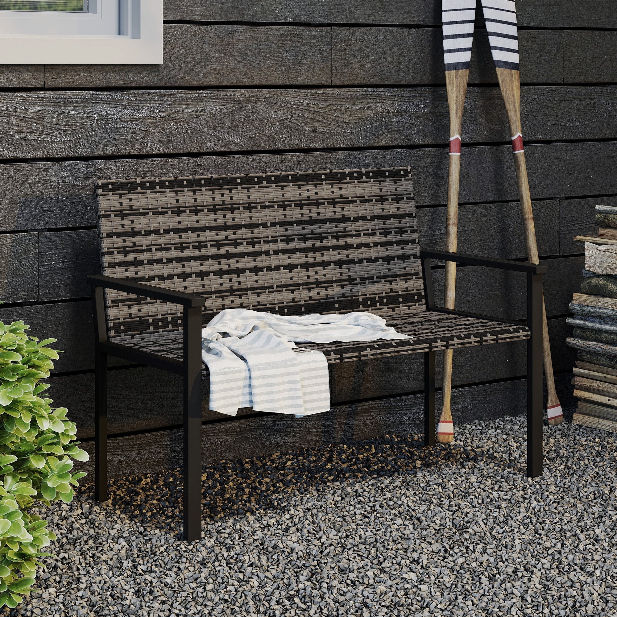 Outsunny two-seater garden bench with black steel frame and woven brown gray wicker seat with striped cloth draped