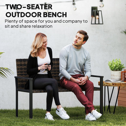 Black metal-framed two-seater garden bench with woven brown wicker and steel frame for outdoor patio use