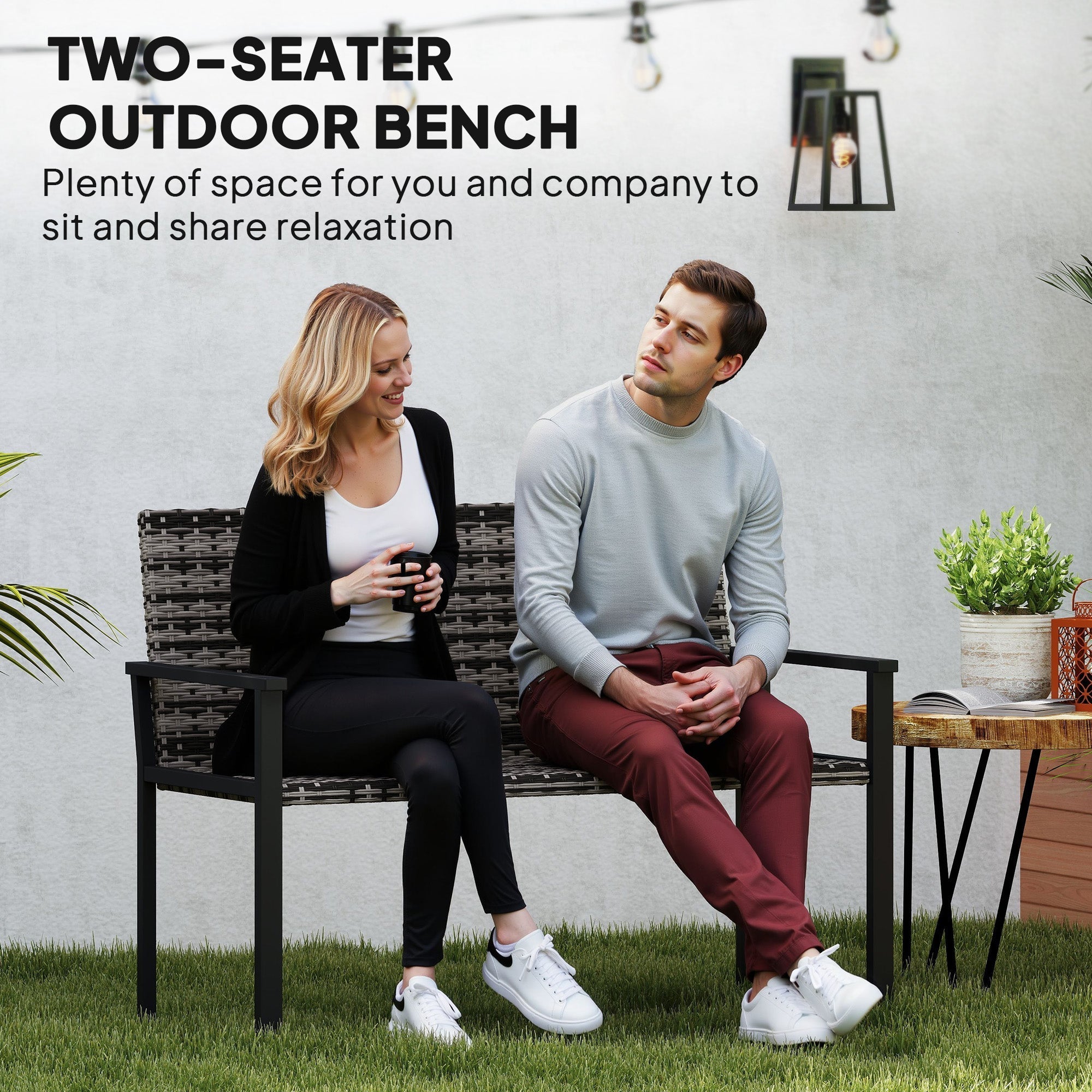 Outsunny black woven wicker two-seater garden bench with steel frame and quick-drying cotton padding for outdoor use