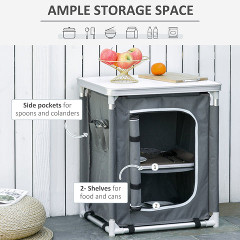 Gray fabric camping kitchen table with white metal frame and side pockets 52l x 42w for outdoor BBQ and picnics