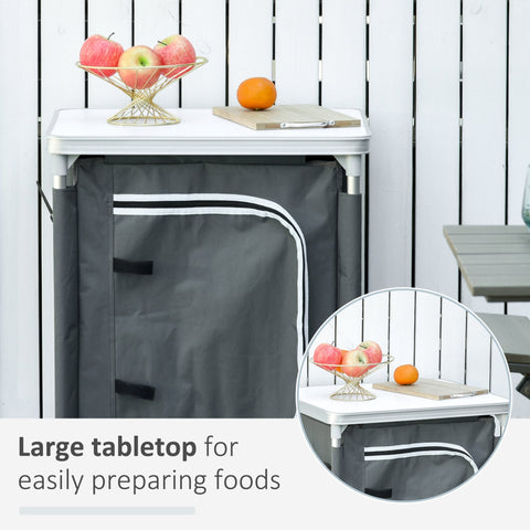 Gray fabric coat 52l x 42w portable camping kitchen table with white trim and metal frame for outdoor use