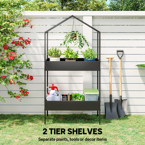 Black metal two tier plant stand with hook allows for grow lights in a house-shaped frame for indoor outdoor use