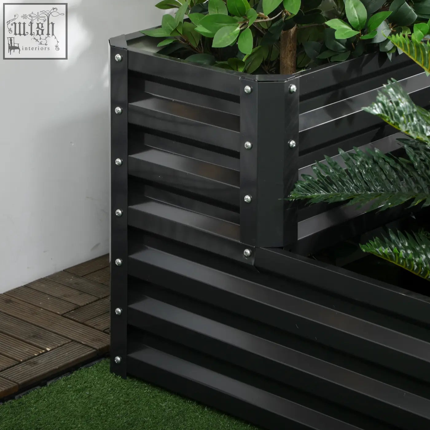 Black metal raised garden bed with horizontal slats and silver rivets made of galvanised steel in dark grey