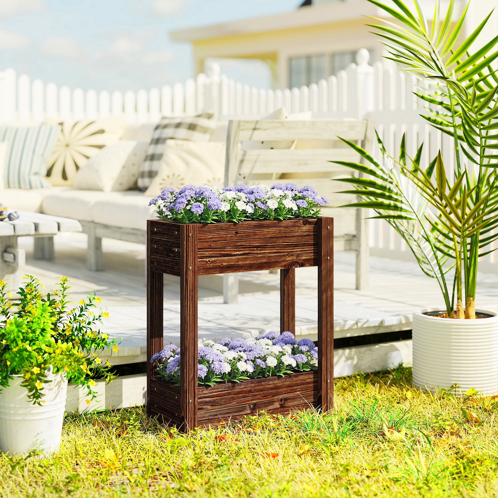 Dark brown fir wood raised planter with two tiers filled with purple and white flowers for garden bed use