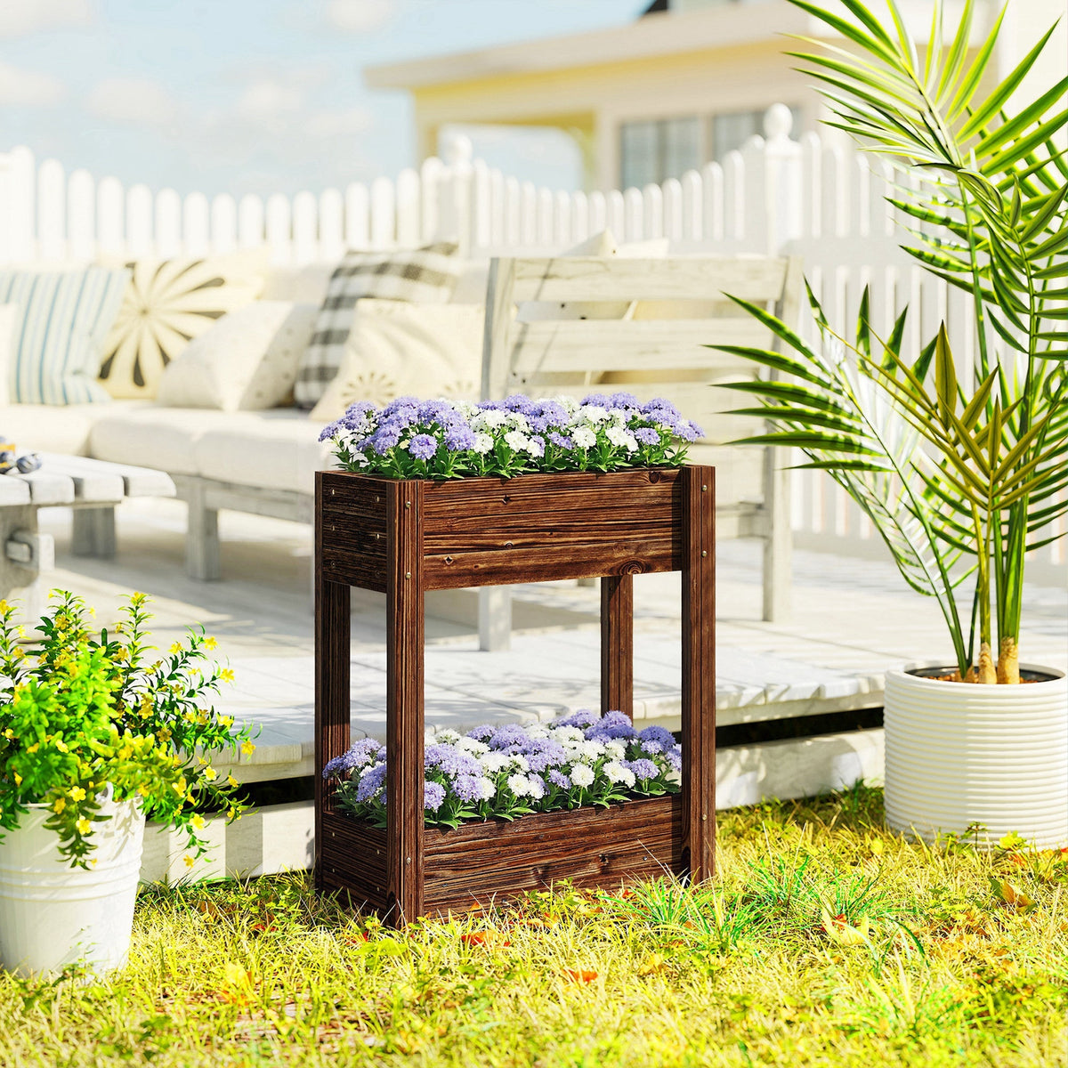 Dark brown fir wood raised planter with two tiers filled with purple and white flowers for garden bed use