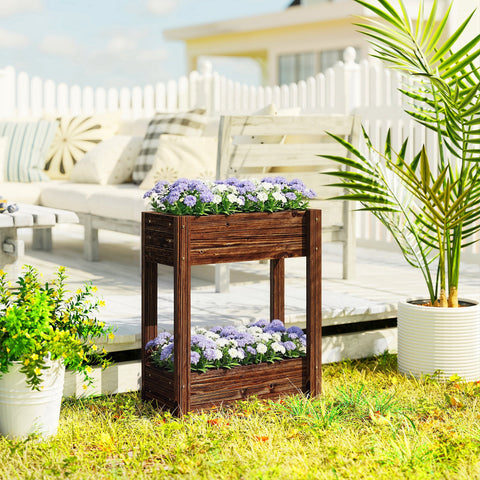 Dark brown fir wood raised planter with two tiers filled with purple and white flowers for garden bed use