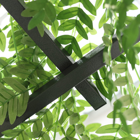 Black metal garden trellis with elegant scrollwork and artificial green leaves adds rustic charm for climbing vines and weddings