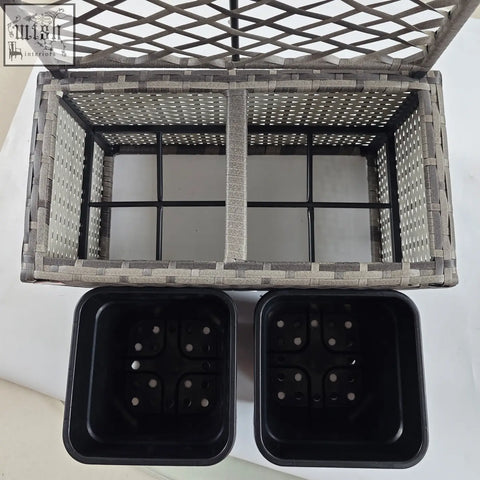 Gray plastic wicker planter box with metal frame and strong core lattice top with two black plant pots outdoors