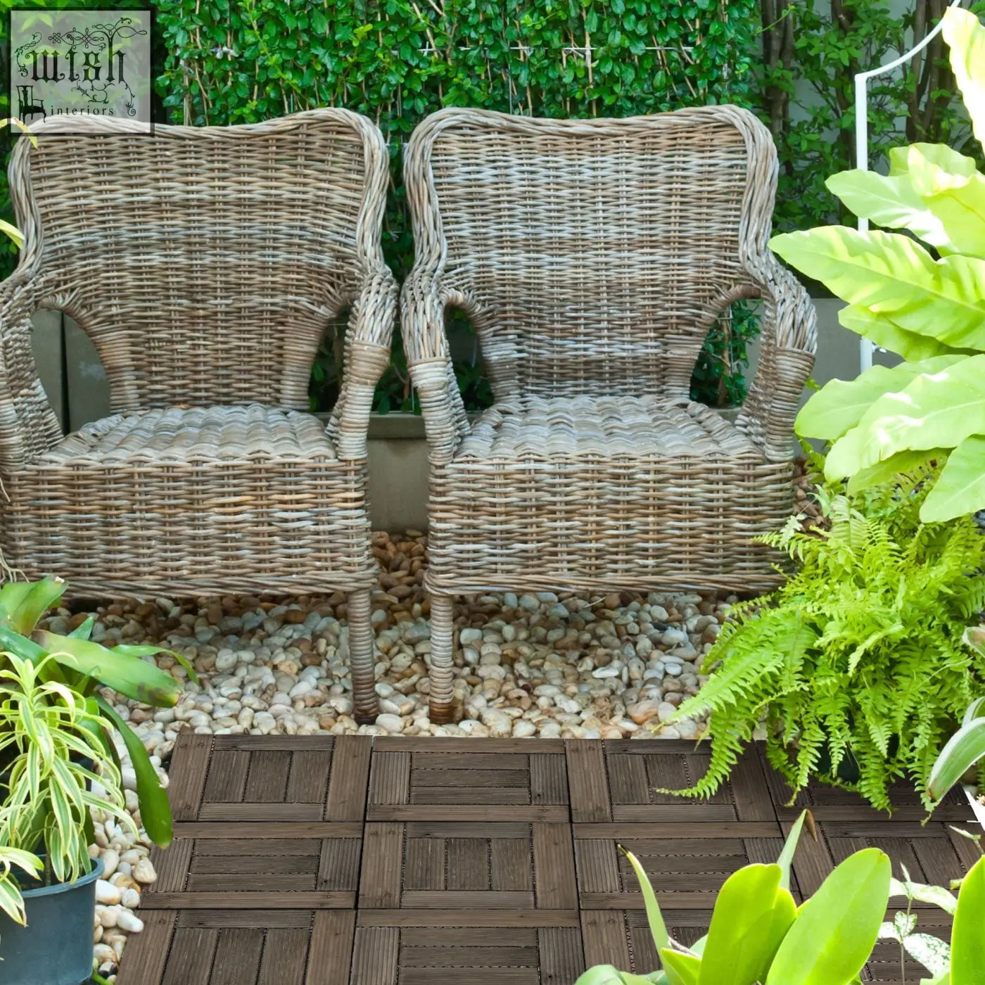 Two matching wicker patio chairs with natural light brown weave sit on charcoal grey outsunny wooden e3 8e a1 deck tiles with pvc bottoms