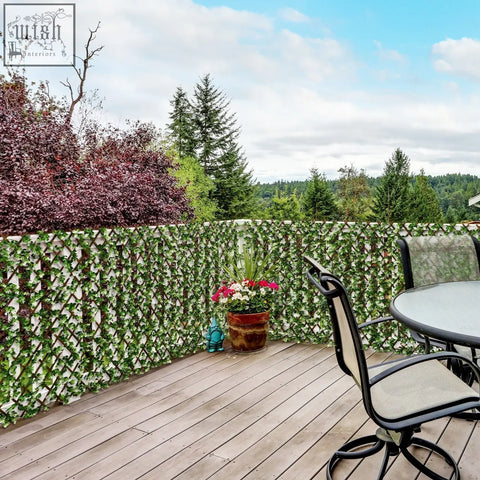 Green ivy-covered outsunny 2pc expanding garden trellis with plastic frame and artificial hedge for 2 square meters privacy wall