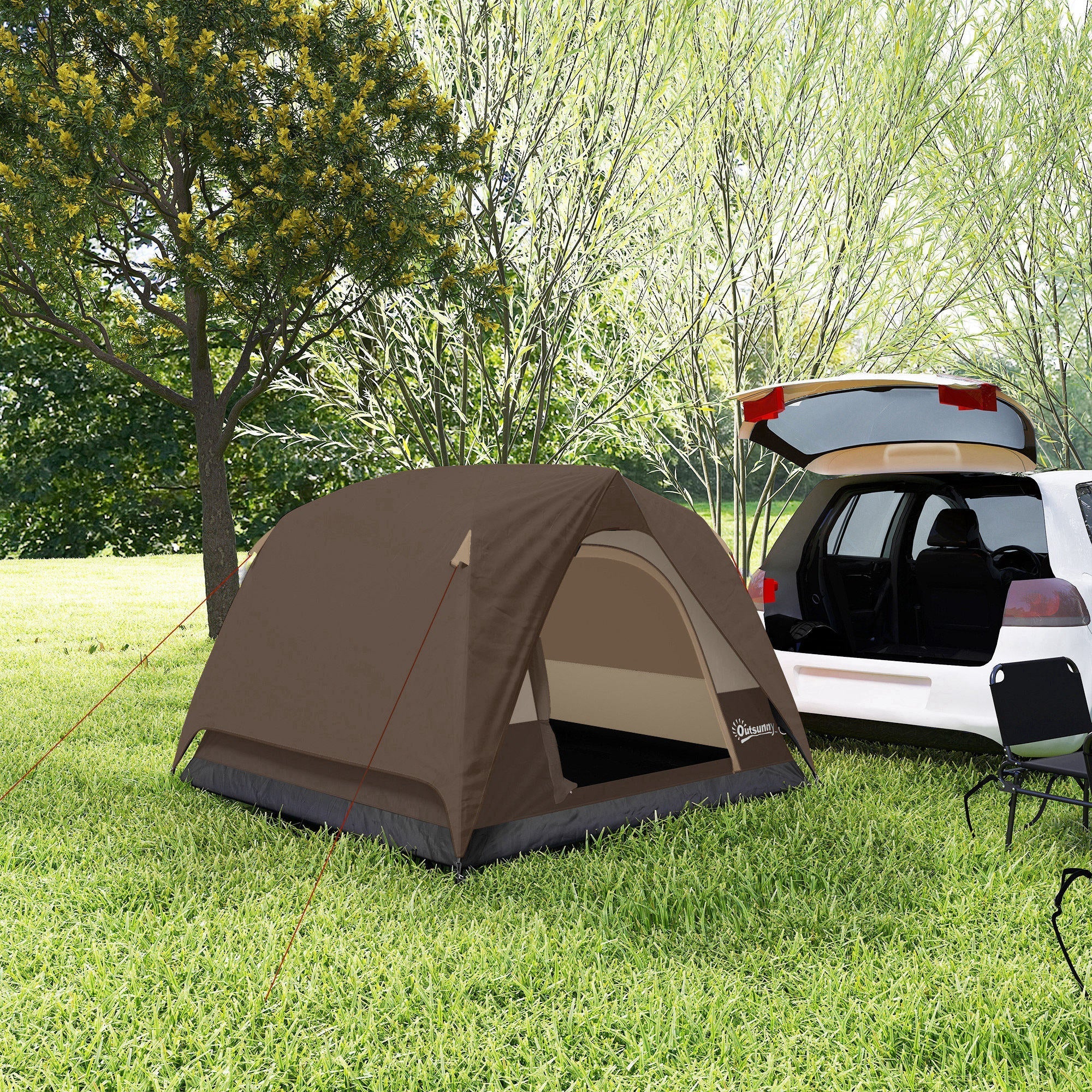 Brown and beige outsunny dome tent with mesh windows and dark gray base set up on grass near a white car