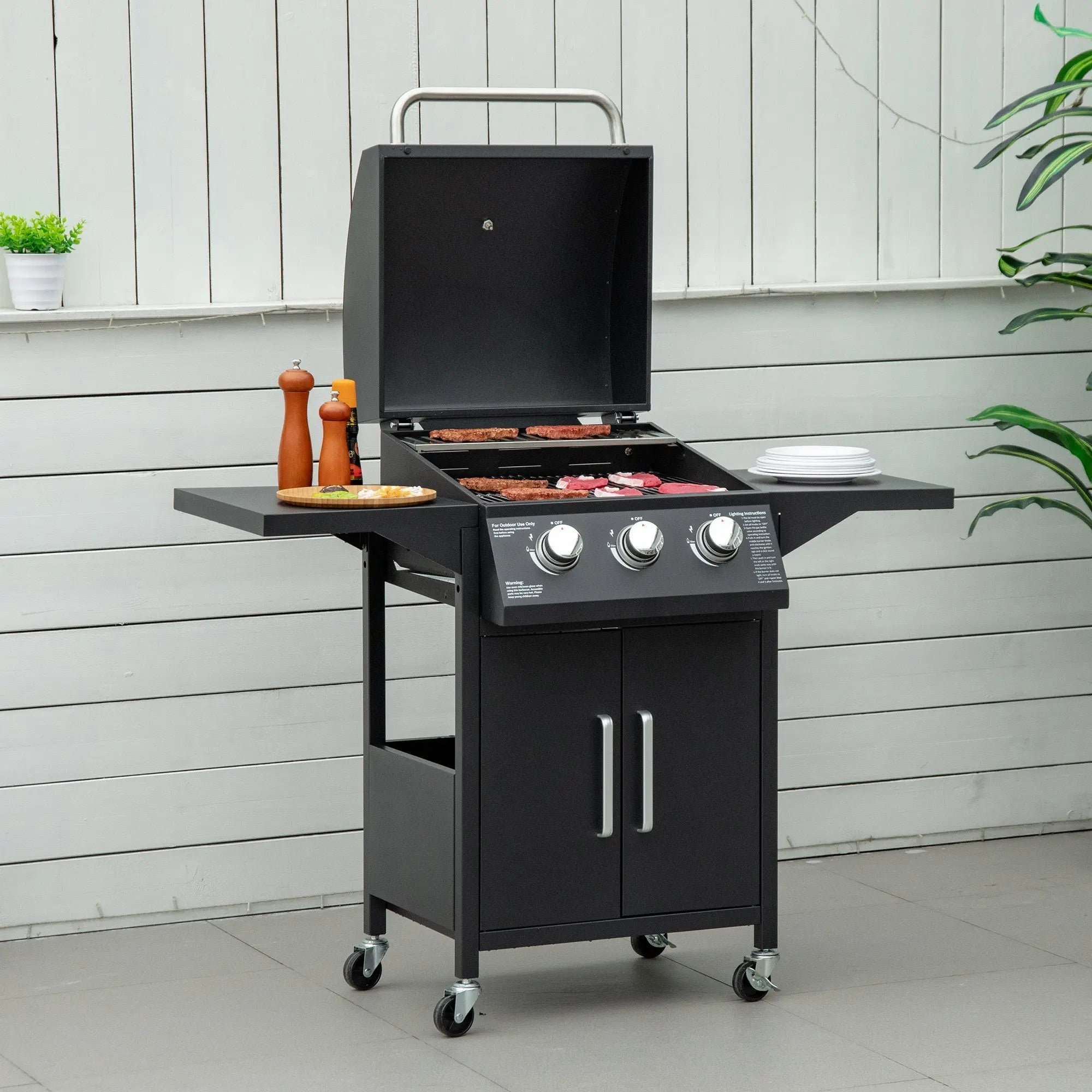 Black carbon steel gas bbq grill with warming rack piezo ignition and storage cabinet on wheeled trolley