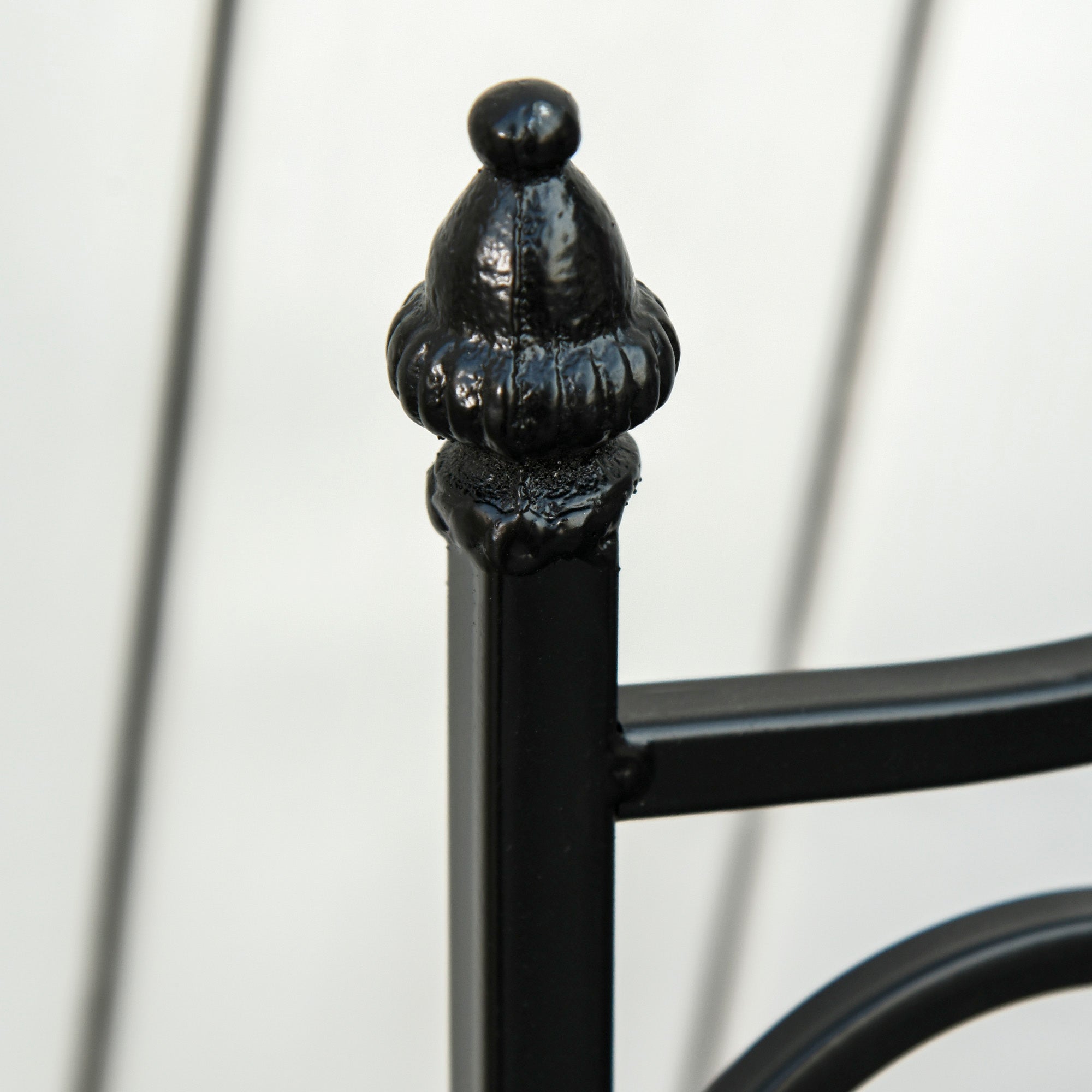 Black wrought iron bedpost with ornate glossy finial part of outsunny garden bistro set metal frame design