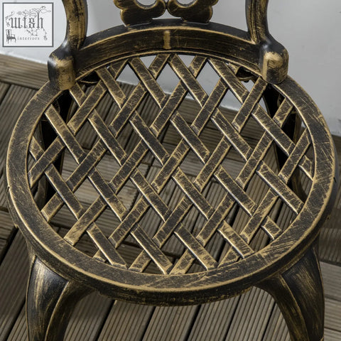 Antique bronze cast aluminium bistro set chair with woven lattice seat and ornate scrollwork backrest for outdoor use