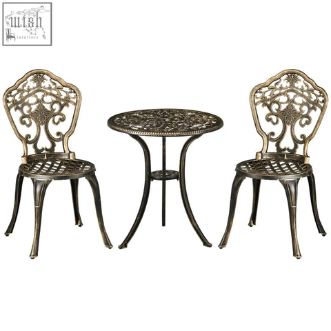 Antique bronze cast aluminium bistro set with ornate scrollwork and round coffee table with parasol hole for patio use