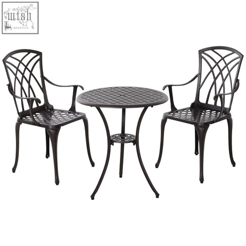 Black cast aluminium garden furniture set with intricate lattice backrests and round table for outdoor dining