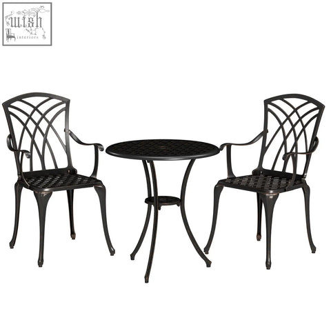 Black cast aluminium garden furniture set with ornate backrests and lattice seats for outdoor dining in bronze tone