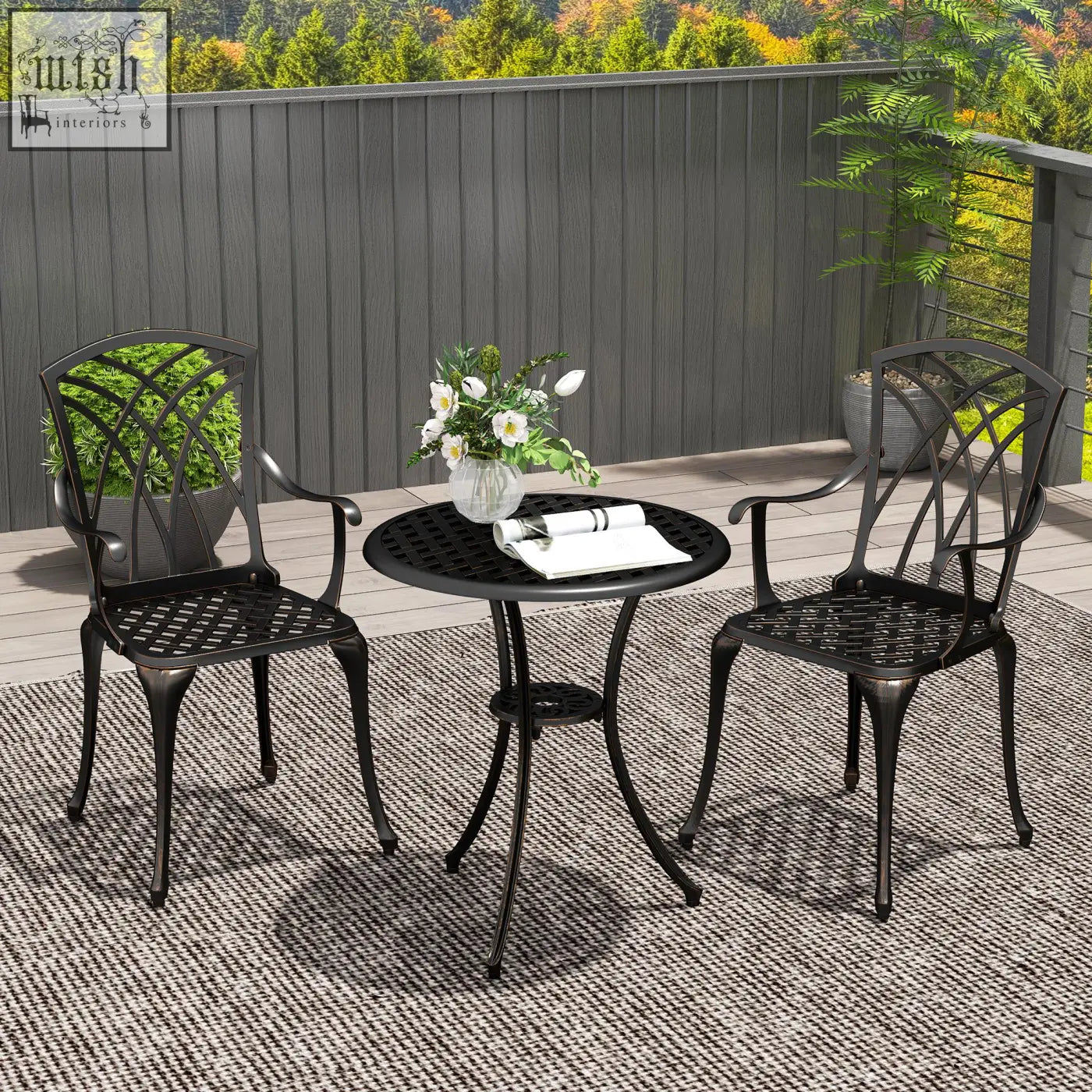 Black wrought iron round patio table with curved legs and lower shelf in bronze cast aluminium garden furniture set
