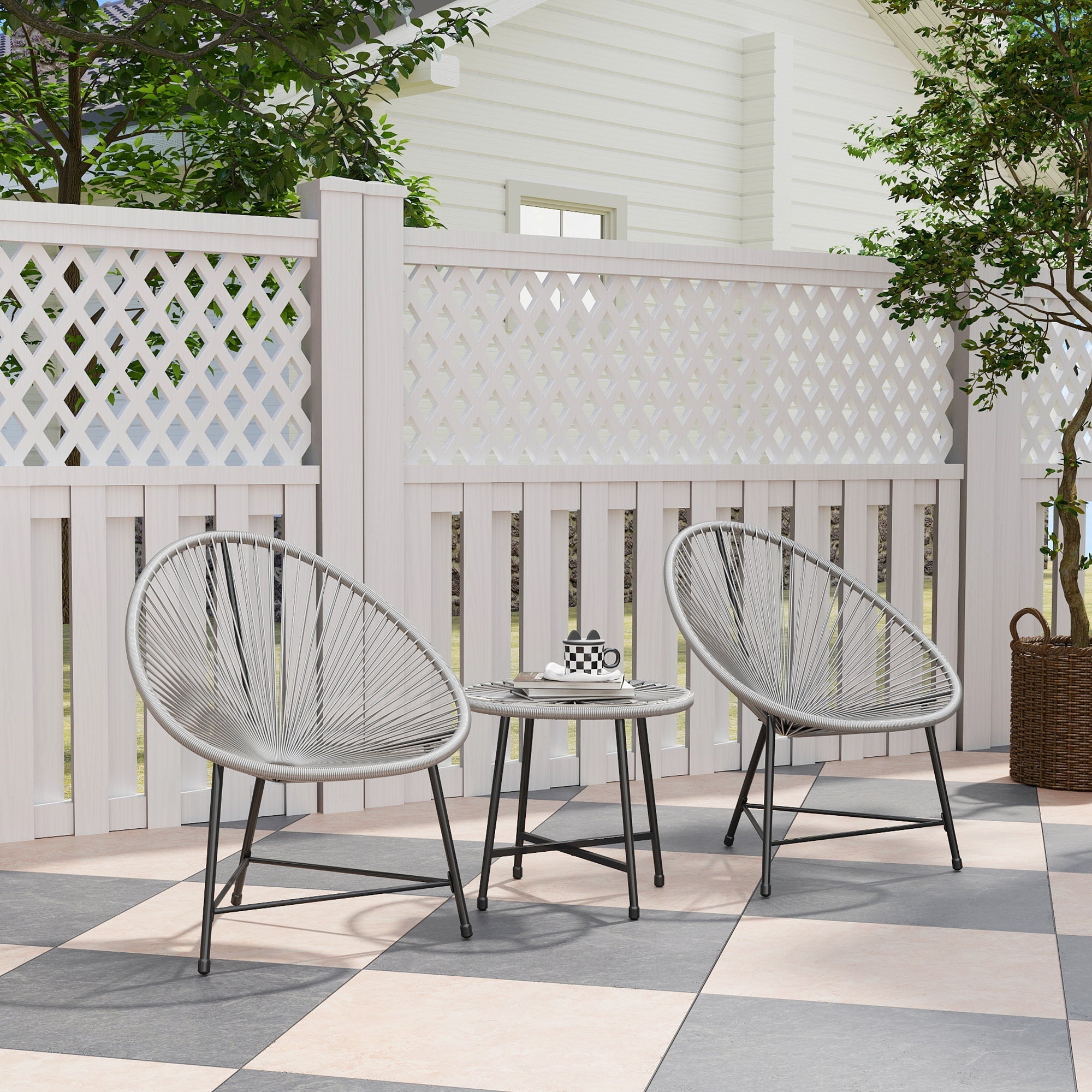 Gray woven wicker acapulco-style oval chairs with black metal frames and a tempered glass garden furniture set table