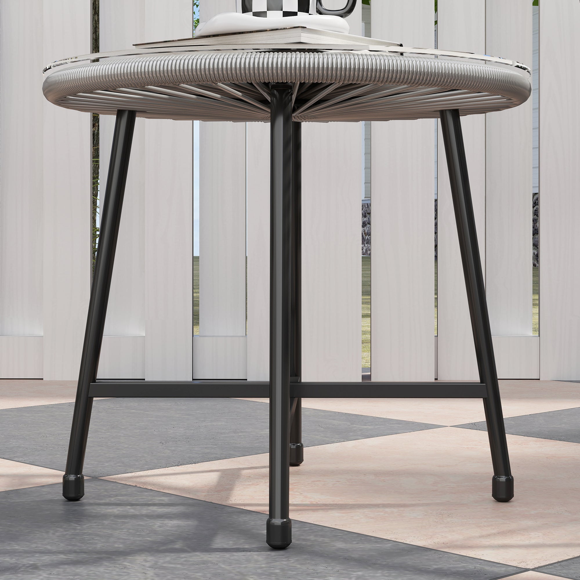 Modern round table with woven gray rattan top and sleek black metal legs in outsunny garden furniture set with tempered glass and acapulco-style oval chairs