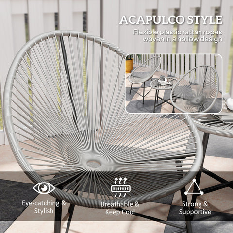 Gray acapulco-style oval chair with flexible plastic rattan ropes in a garden furniture set with tempered glass table