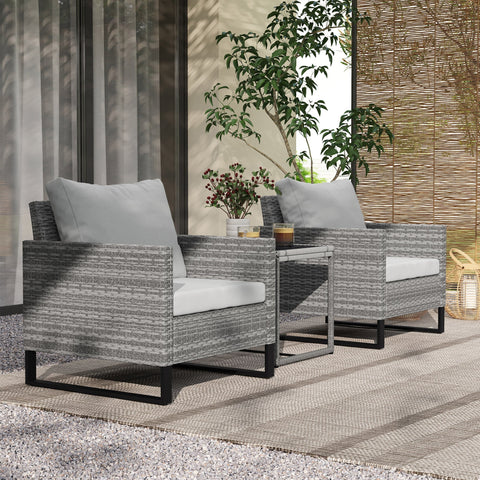 Gray woven wicker outdoor armchairs with white cushions and black legs in outsunny rattan bistro set with glass table