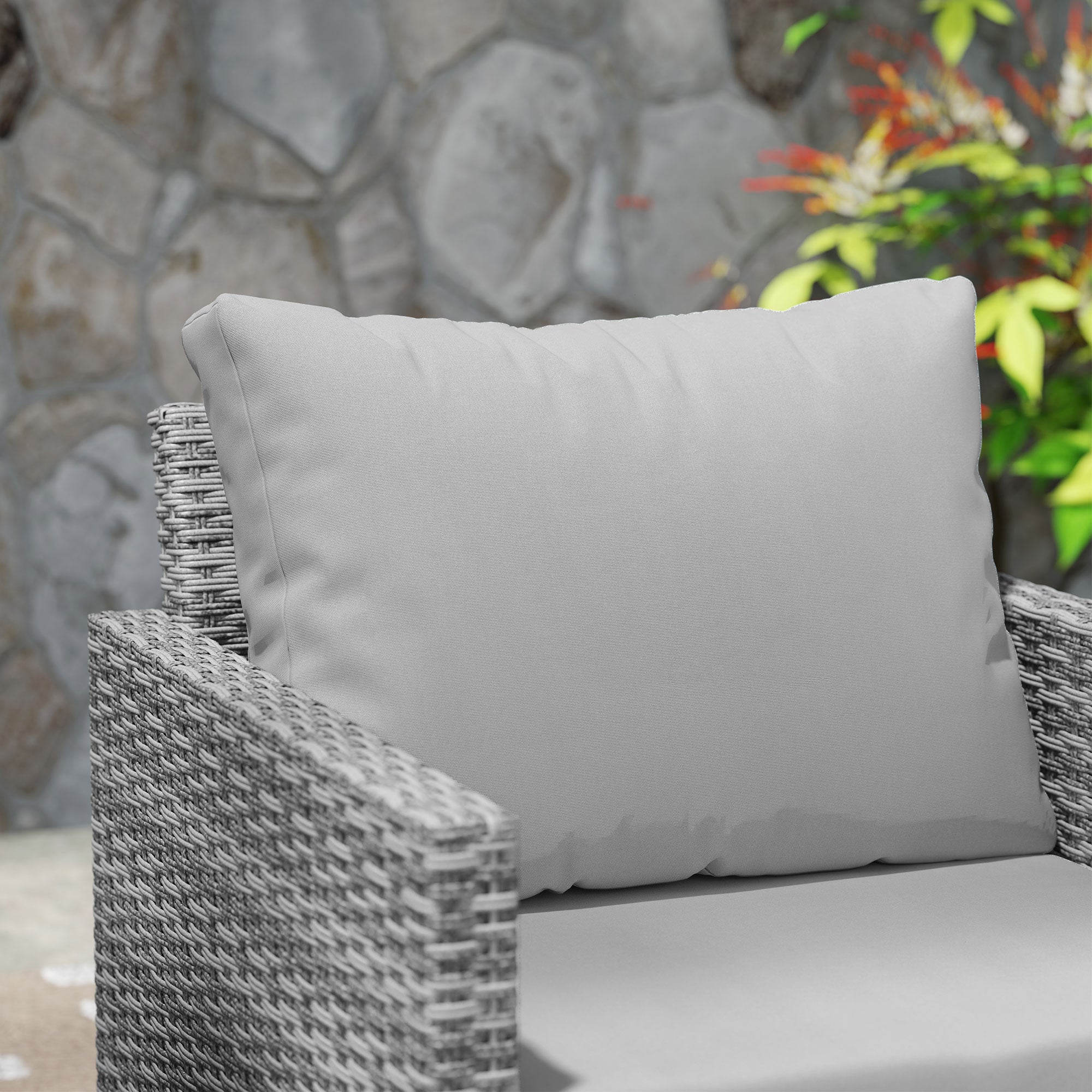 Light gray cushion with soft plush texture on woven wicker chair in outsunny rattan bistro set for outdoor patio