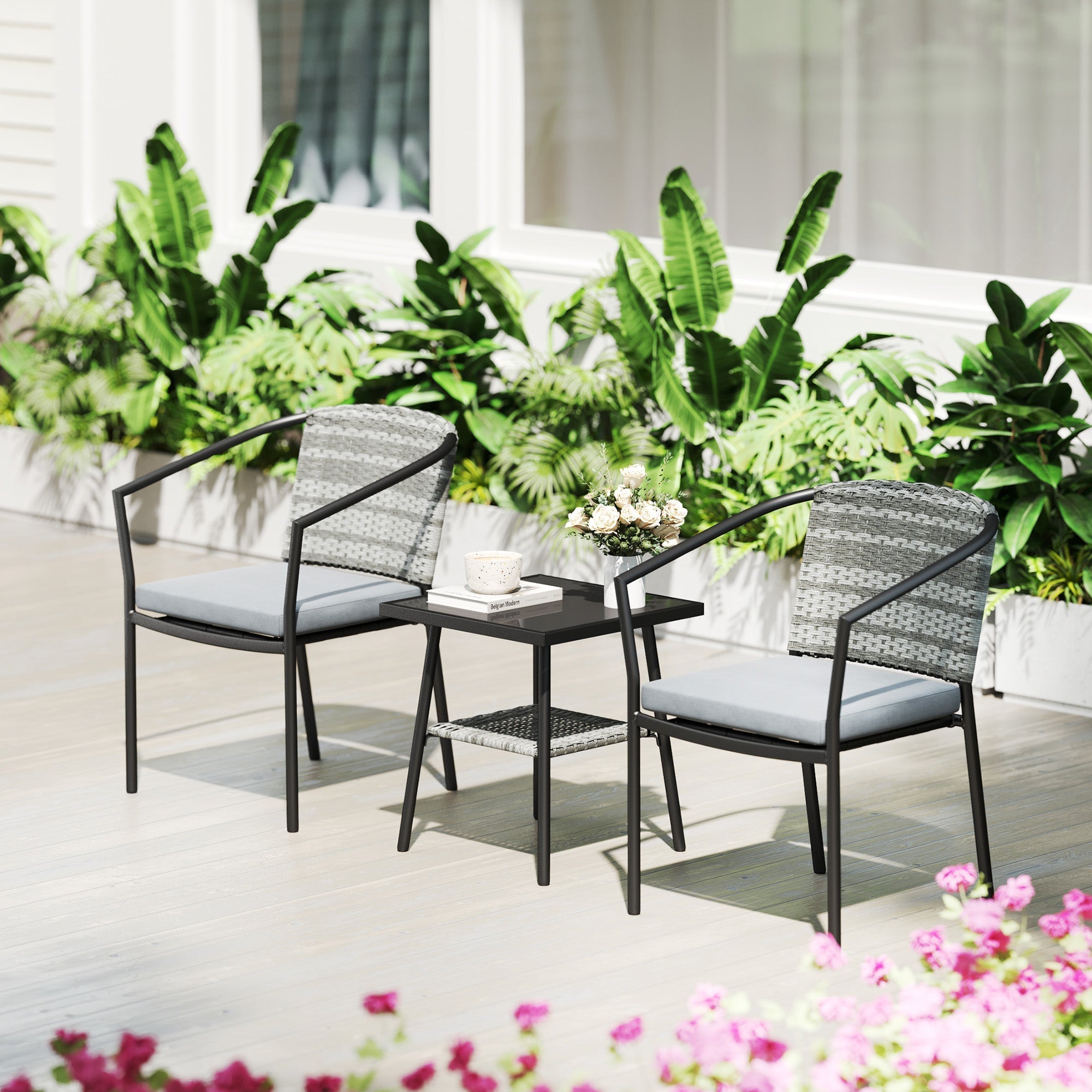 Modern gray woven rattan bistro set with black metal frames and light gray cushions for outdoor patio use