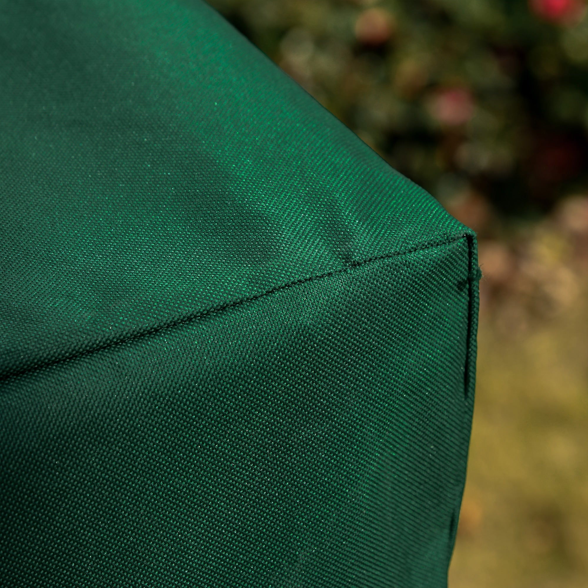 Deep green oxford fabric cushion with visible stitching on outsunny 3-seat swing chair cover for outdoor use