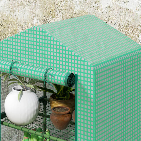 Outsunny 3 tier mini greenhouse with mint green plastic cover, roll-up door, and metal wire shelves for potted plants