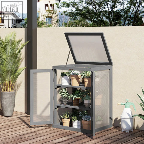 Gray metal garden storage unit with mesh sides and hinged lid featuring three shelves holding potted plants in dark grey polycarbonate panels