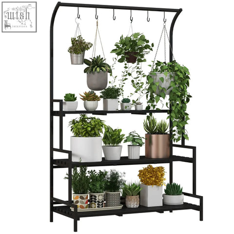 Black metal plant stand with steel frame and tiered plant rack holding various potted plants and hanging hooks