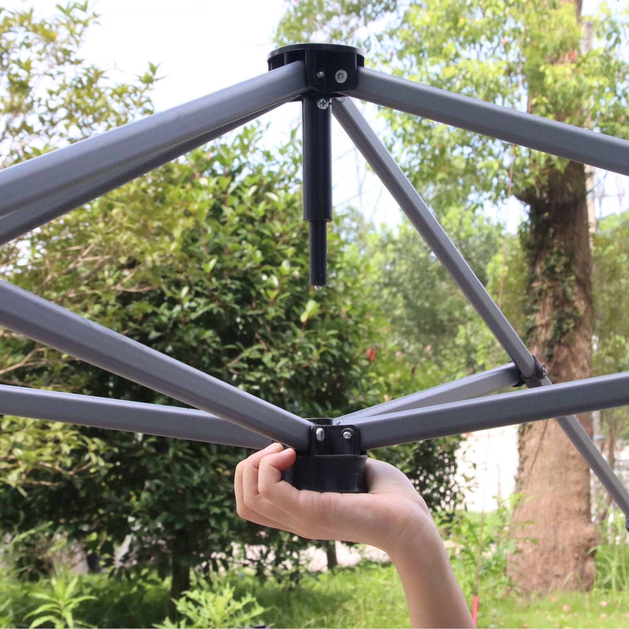 Gray metal frame with black joints of outsunny 3x3 pop up gazebo featuring uv50+ fabric canopy for outdoor use