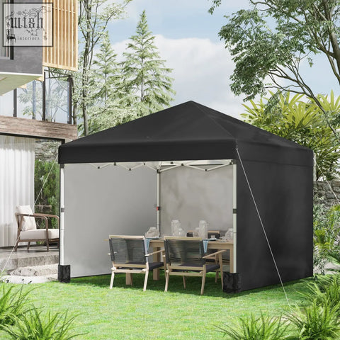 Black pop-up gazebo with gray side panel and white metal frame includes wheeled bag and stakes for easy setup