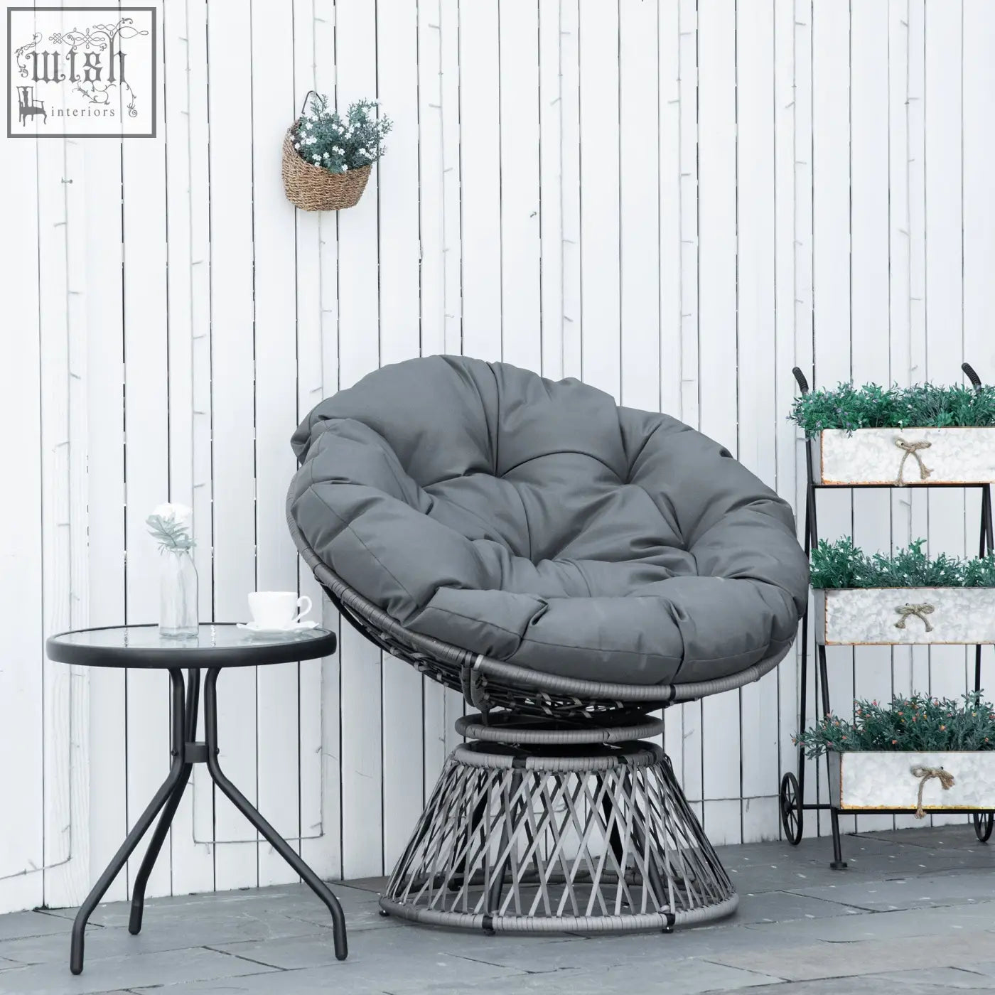 Gray cushioned outsunny swivel papasan chair with woven wicker frame and steel frame underneath for indoor outdoor use