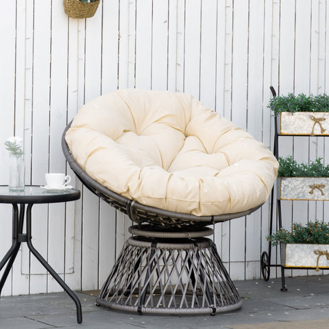 Cream cushioned papasan chair with dark gray woven wicker frame and steel frame underneath 360-degree swivel base