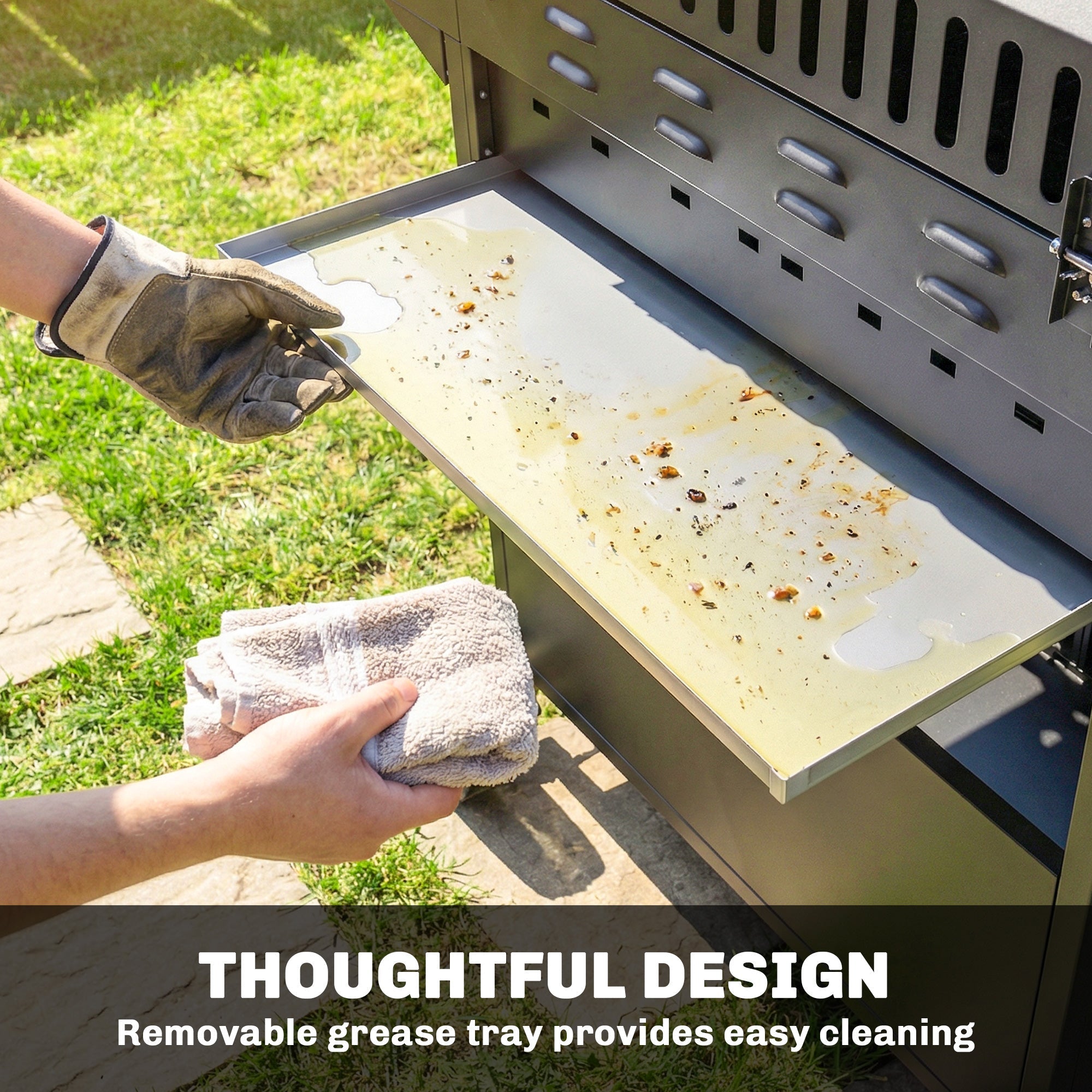 Hand wiping removable stainless steel grease tray of outsunny 4+1 burner gas bbq grill with warming rack and side table