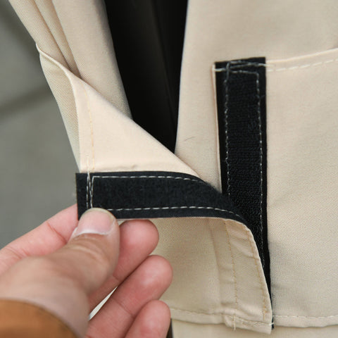 Beige canvas gazebo curtain panel with black velcro strap detail for outdoor gazebo frame privacy and shelter