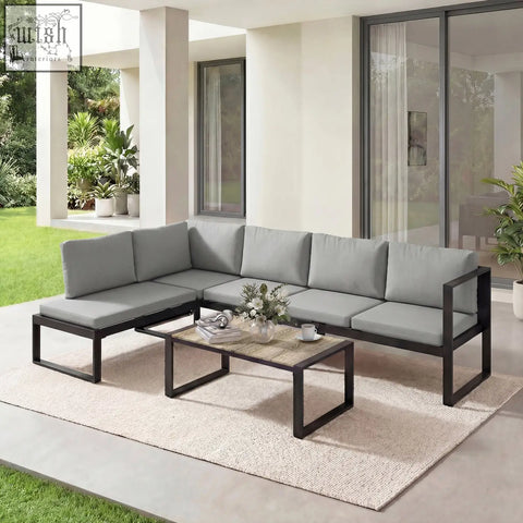 Modern gray outdoor sectional garden sofa set with powder-coated steel frame and coffee table for balcony use