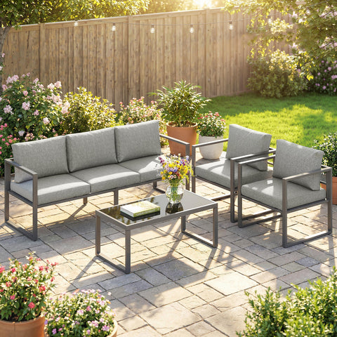 Outsunny 4 piece outdoor garden furniture set in gray with sleek metal frames and coffee table on stone patio 60d x 62h