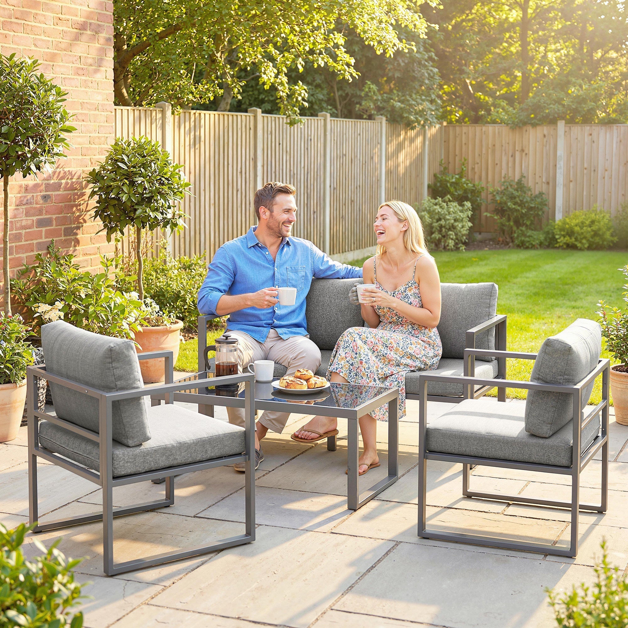 Modern gray outsunny 4 piece outdoor furniture set with plush cushions metal frames and coffee table 60d x 62h