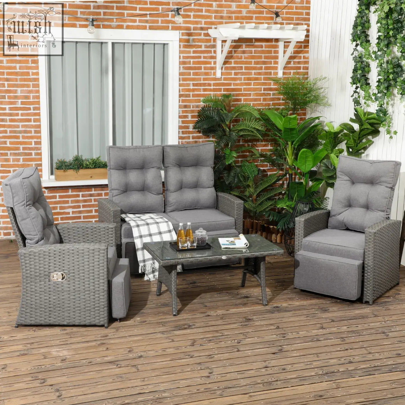 Gray wicker outdoor furniture set with cushioned recliners and galvanised steel frame coffee table for poolside use