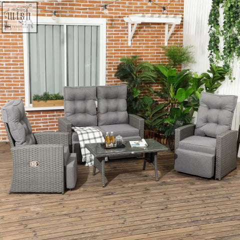 Gray wicker outdoor furniture set with cushioned recliners and galvanised steel frame coffee table for poolside use