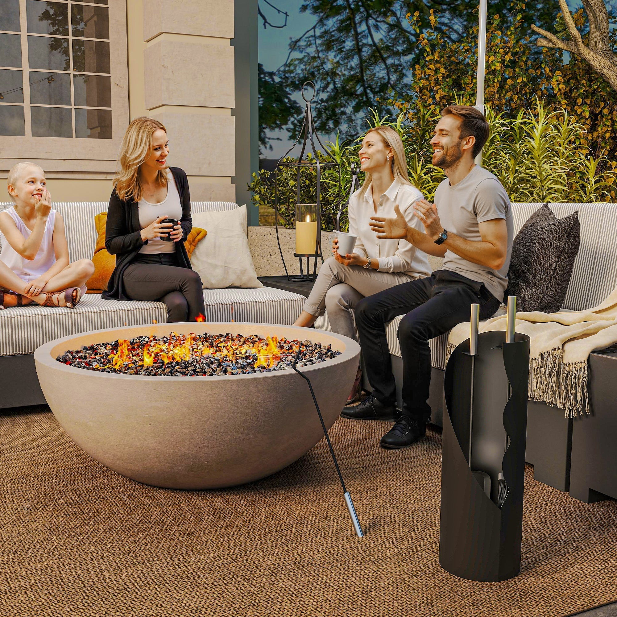 Beige concrete fire pit with glowing flames surrounded by pebbles and outsunny 4 piece companion set includes broom shovel poker and bucket