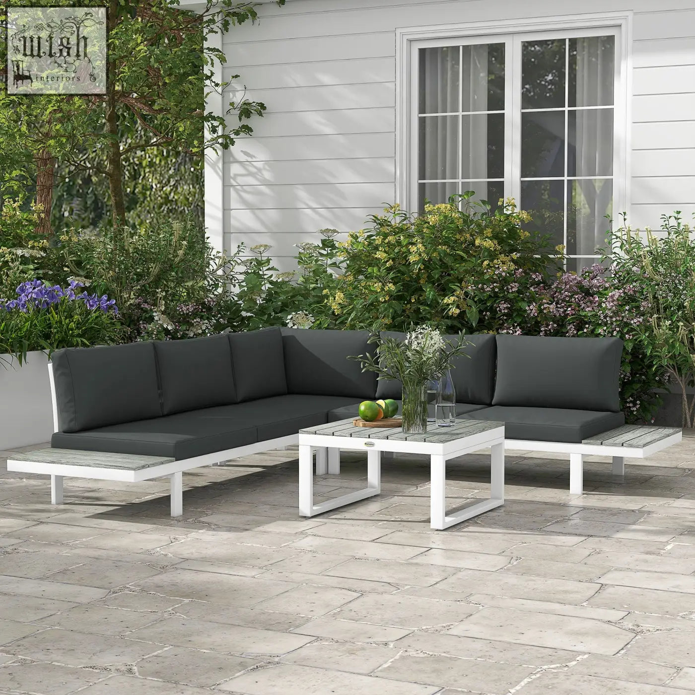 White outdoor corner sofa with dark gray cushions and matching coffee table with powder coated steel frame