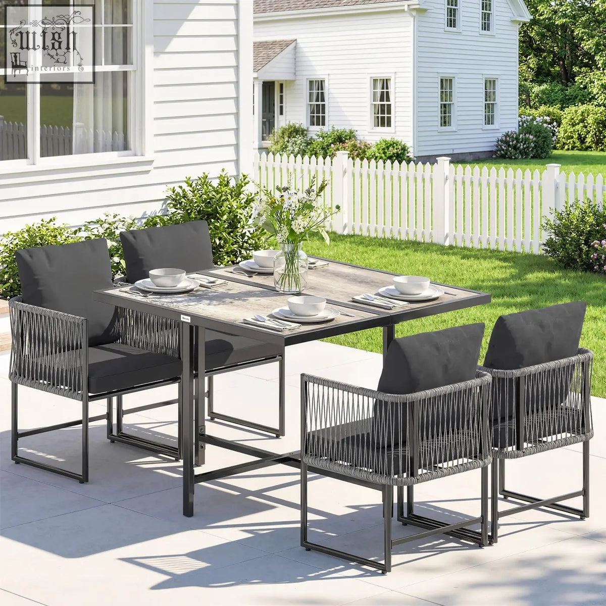 Outsunny 4-seater garden dining set with dark gray woven wicker table and black cushioned rattan chairs for outdoor use