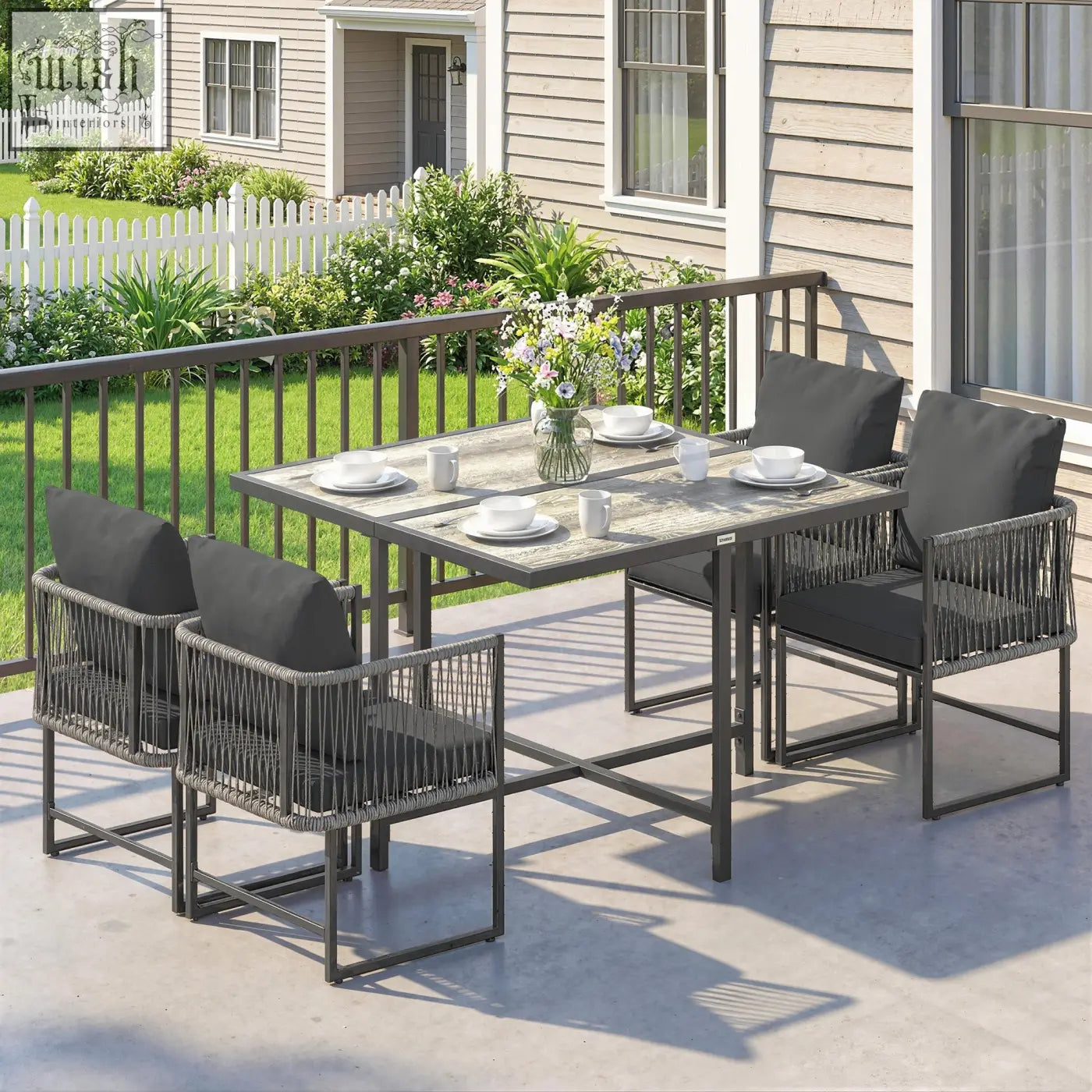 Gray woven wicker garden dining set with dark gray cushions and matching table for patio space-saving design