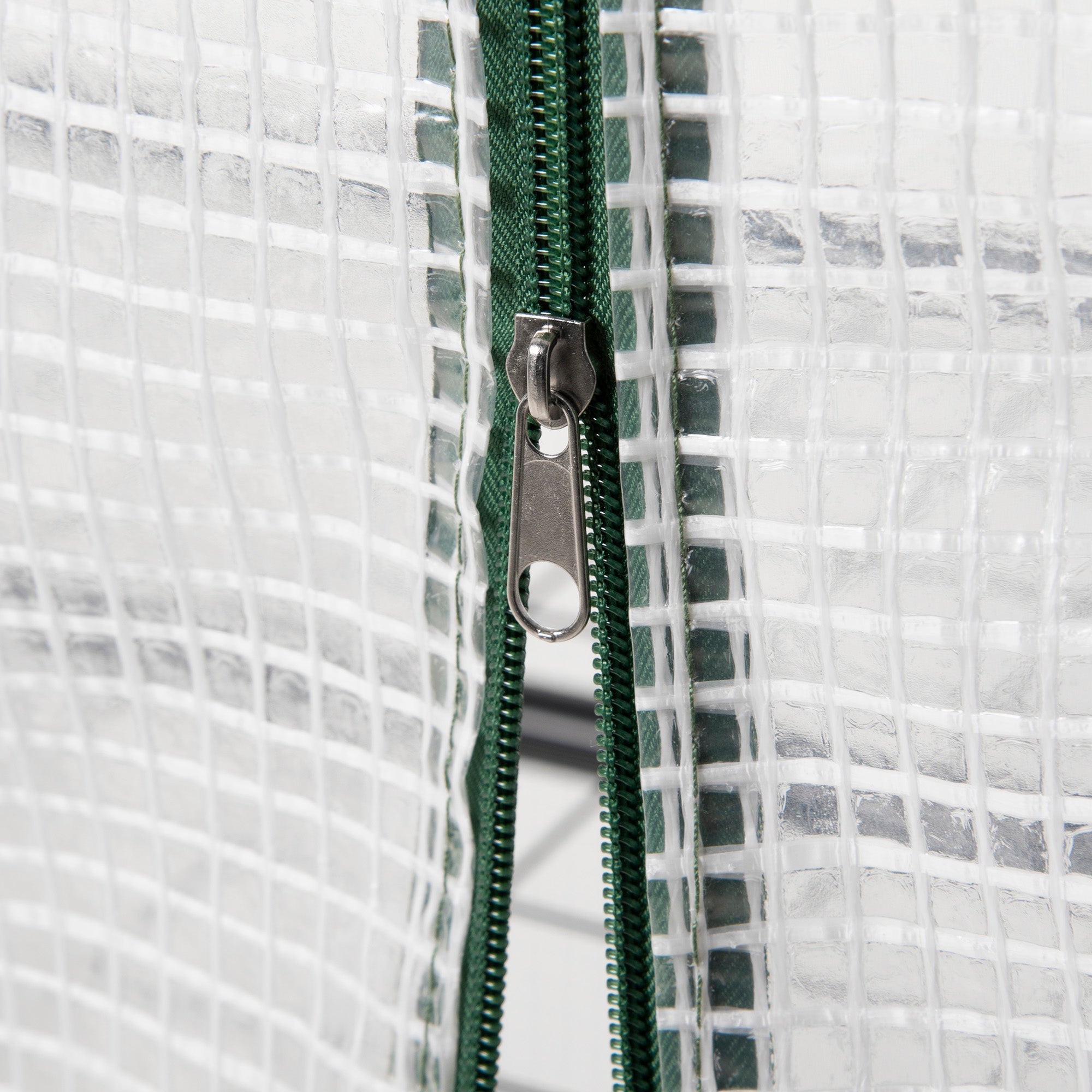 Green zipper with silver pull tab on Outsunny 4 tier mini greenhouse roll-up door for easy access steel frame design